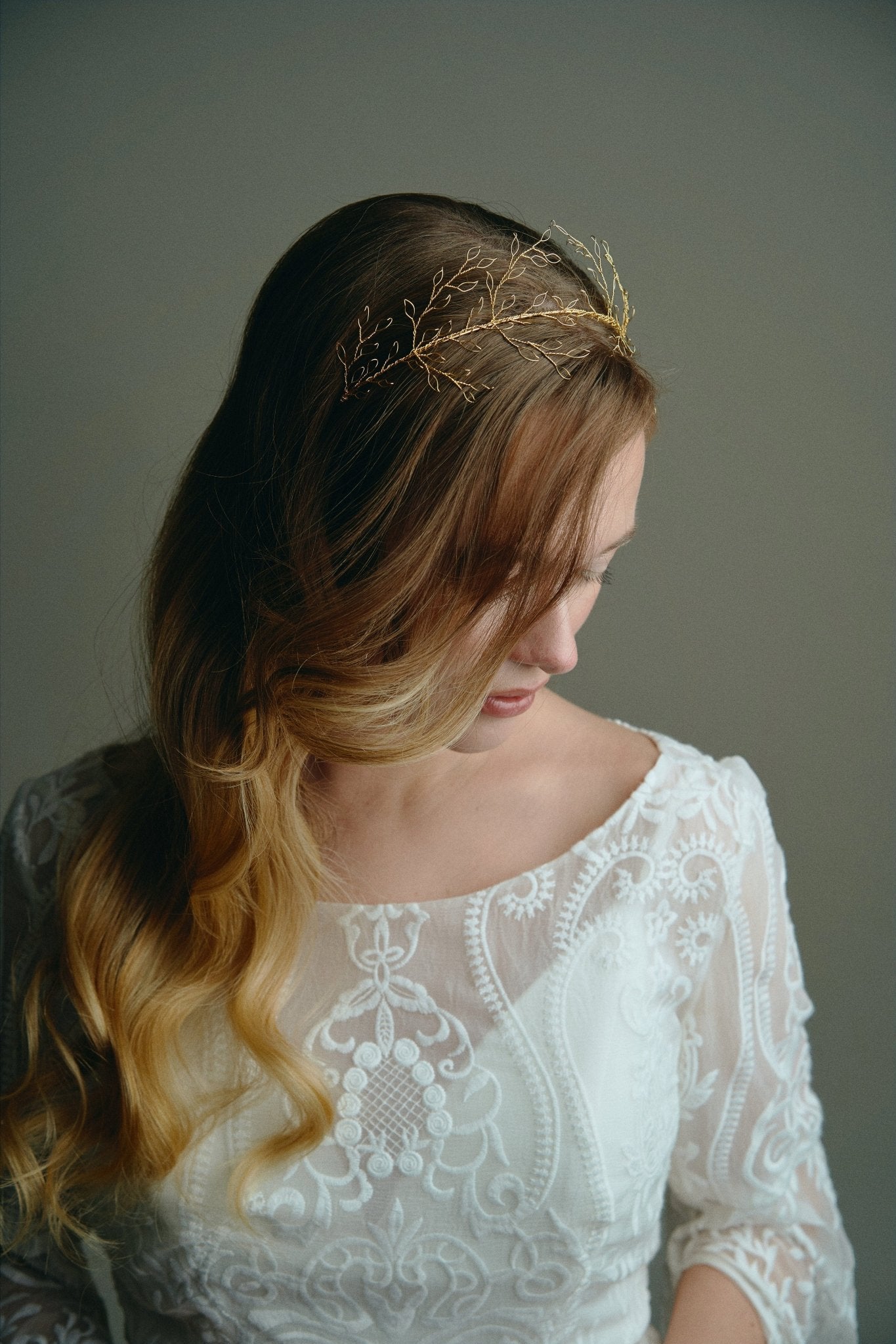 Model wears leaf crown in gold