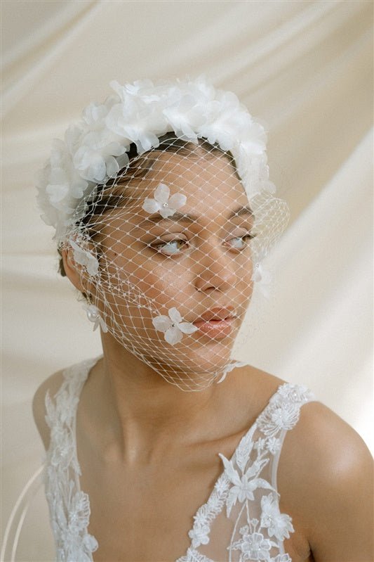Betsy Ivory Birdcage Veil With 3D Silk Flowers worn with the Florence silk flower padded headband
