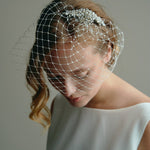https://www.debbiecarlisle.com/products/hand-sewn-ivory-merry-widow-birdcage-veil