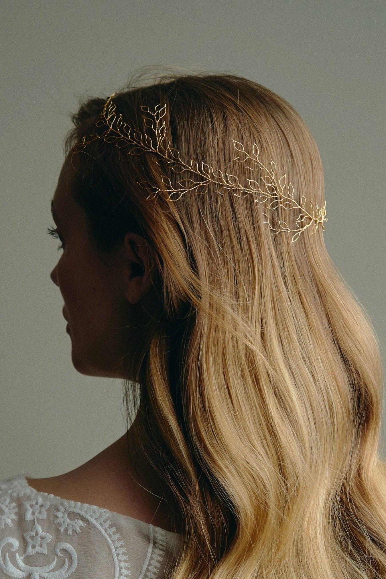 Bridal Hair Vine - model wears long leafy gold bridal hair vine