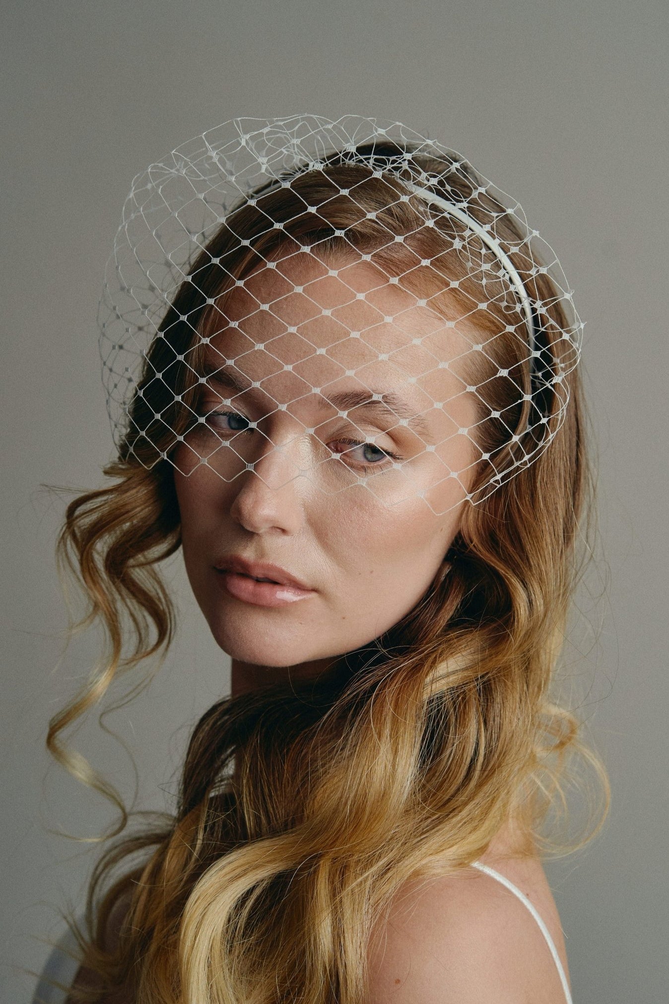 Slim ivory satin headband with attached Merry Widow veil