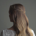 Model wears long bridal hair vine