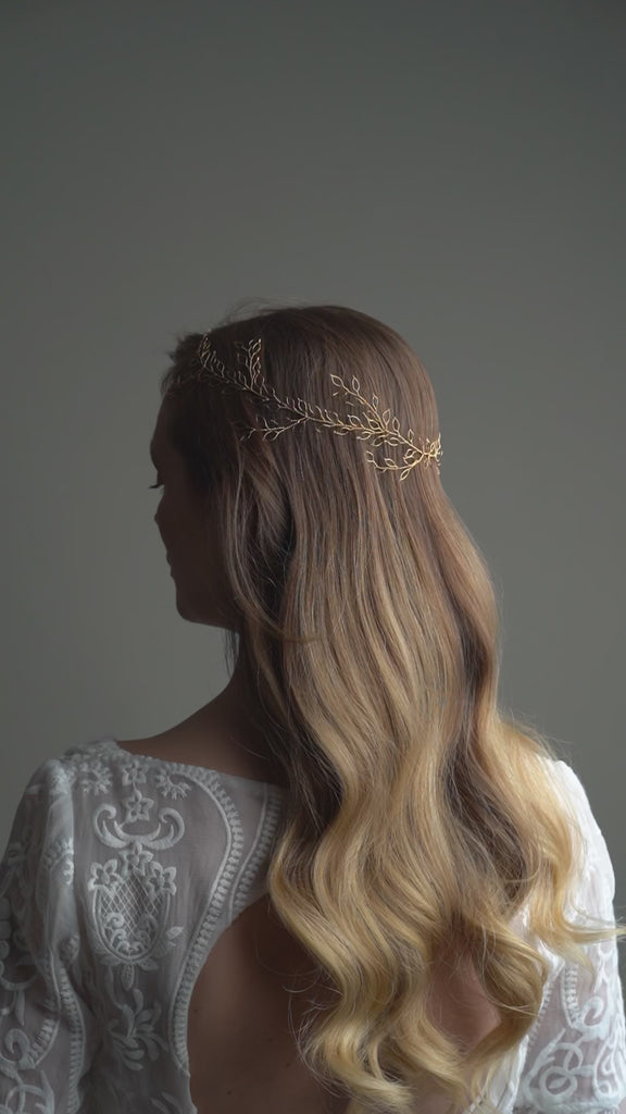Model wears long bridal hair vine