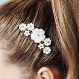 Beth mother of pearl flower comb by Debbie Carlisle worn with sleek high ponytail