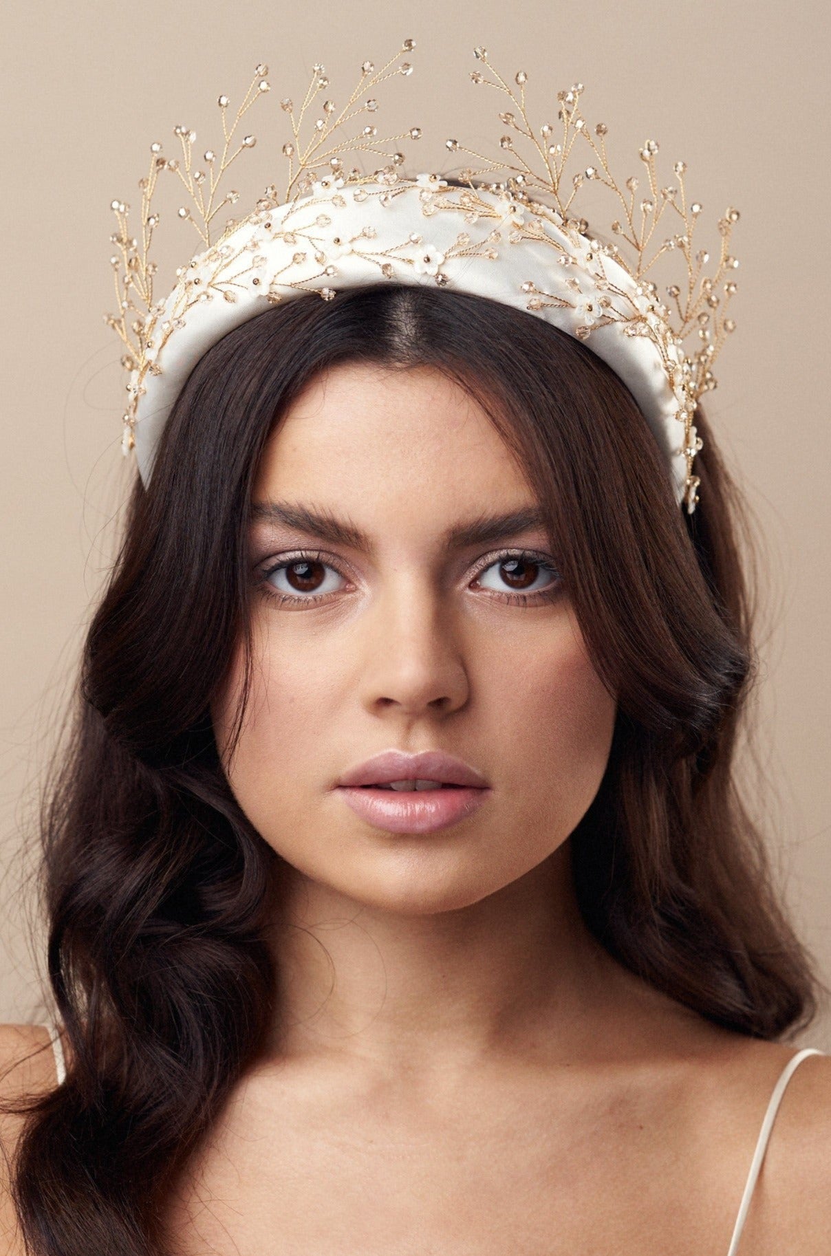Embellished floral ivory padded headband worn with gold crystal crown