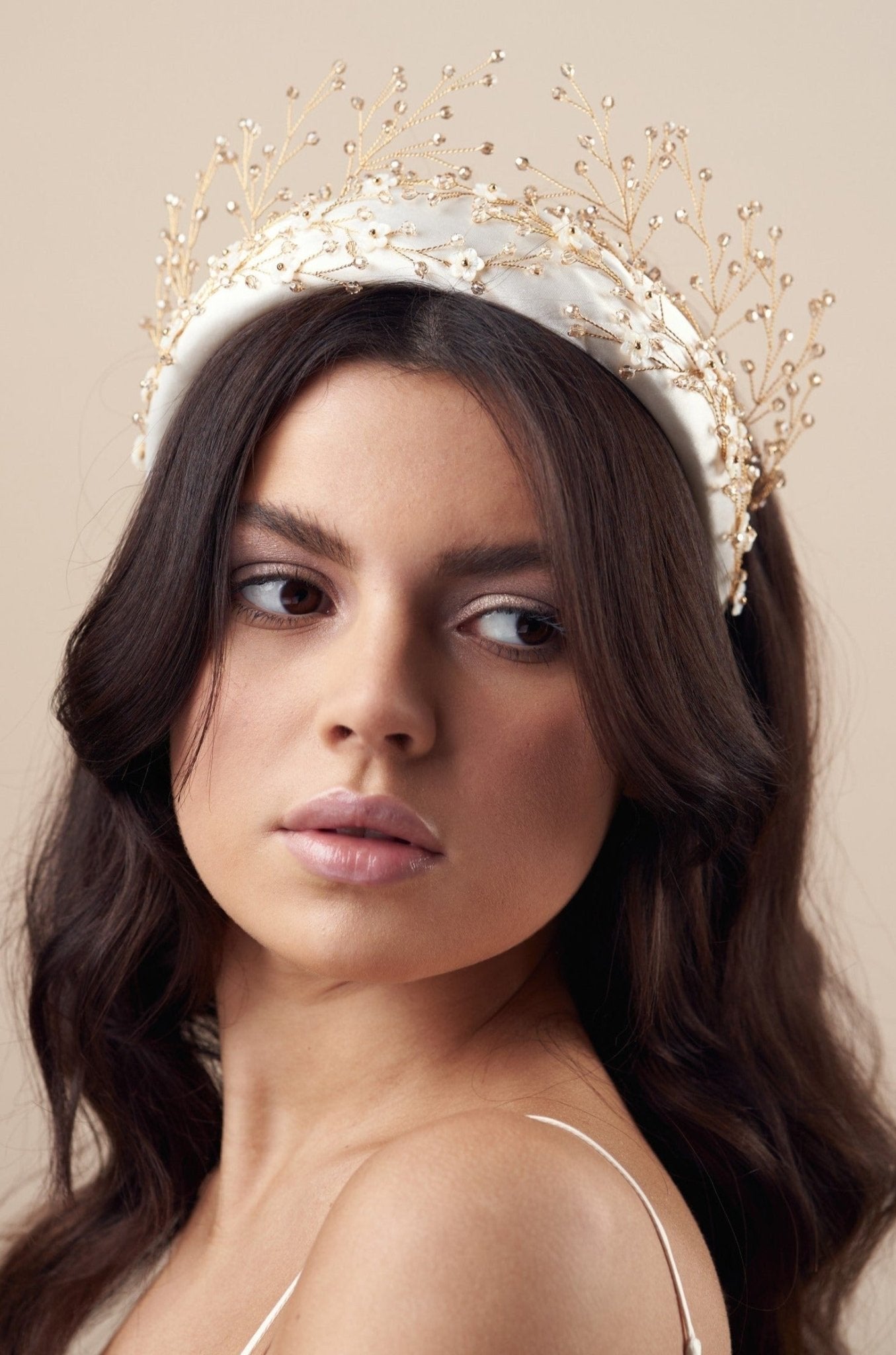 Embellished floral gold and ivory padded headband teamed with a golden crystal crown