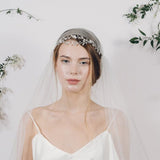 Delicate silver crystal wedding headband with Juliet cap veil