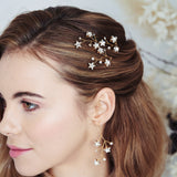 Gold Lunaria Swarovski Crystal star cluster earrings worn with Lunaria hair pins