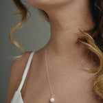 Sustainable vegan pearl huggies and matching Lola pearl necklace - silver