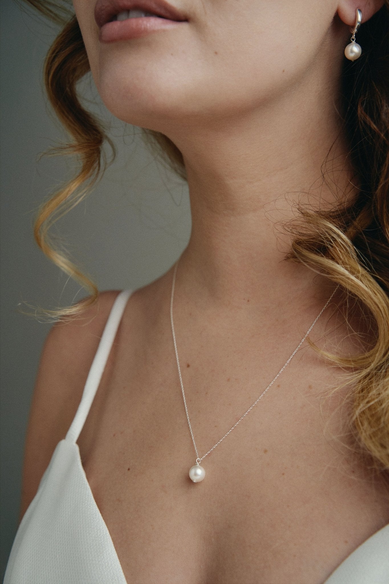 Sustainable vegan pearl huggies and matching Lola pearl necklace - silver
