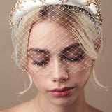 Gold and ivory padded headband with birdcage veil