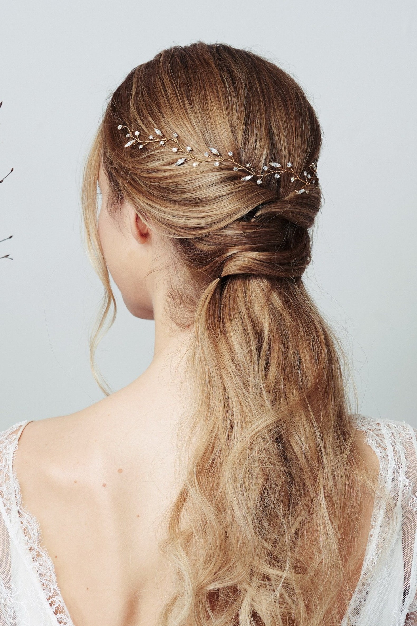 Bohemian leaf hairvine worn with low ponytail half updo