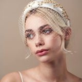 Short birdcage veil styled with Gold and Ivory  crystal padded headband