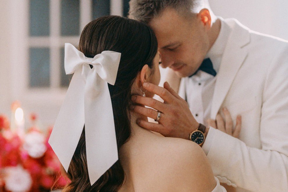 a white satin hair bow for a modern romantic bride and groom