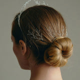Leafy Wedding Hair Pins - Setof  Four Silver  Hairpins worn by model in the back of a low bun updo 
