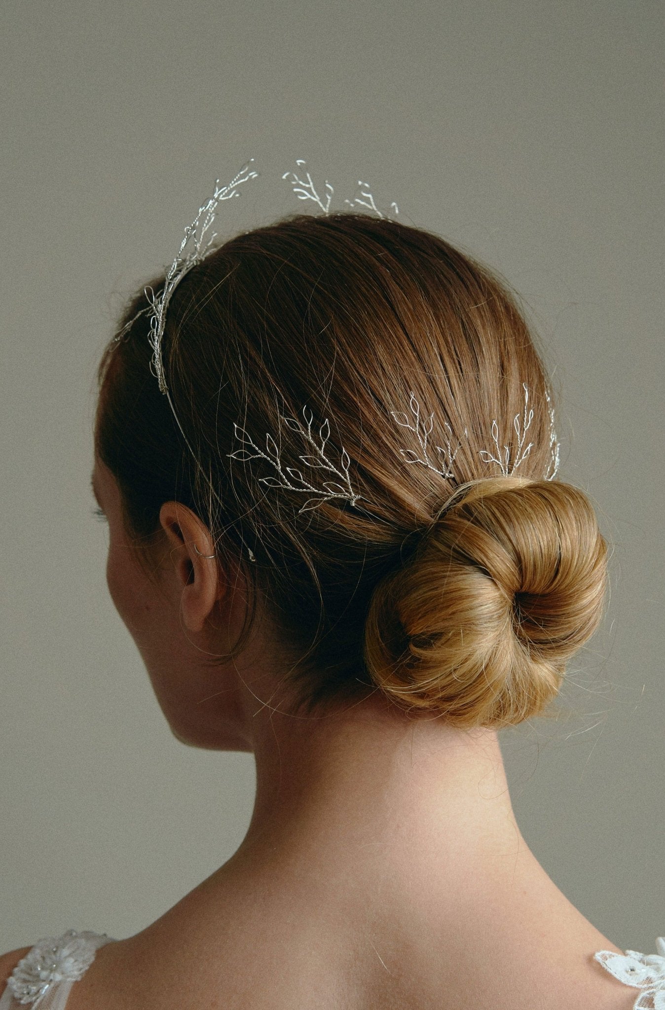 Leafy Wedding Hair Pins - Setof  Four Silver  Hairpins worn by model in the back of a low bun updo 