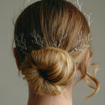 Leafy Wedding Hair Pins - Setof  Four Silver  Hairpins worn by model in the back of a low bun updo 