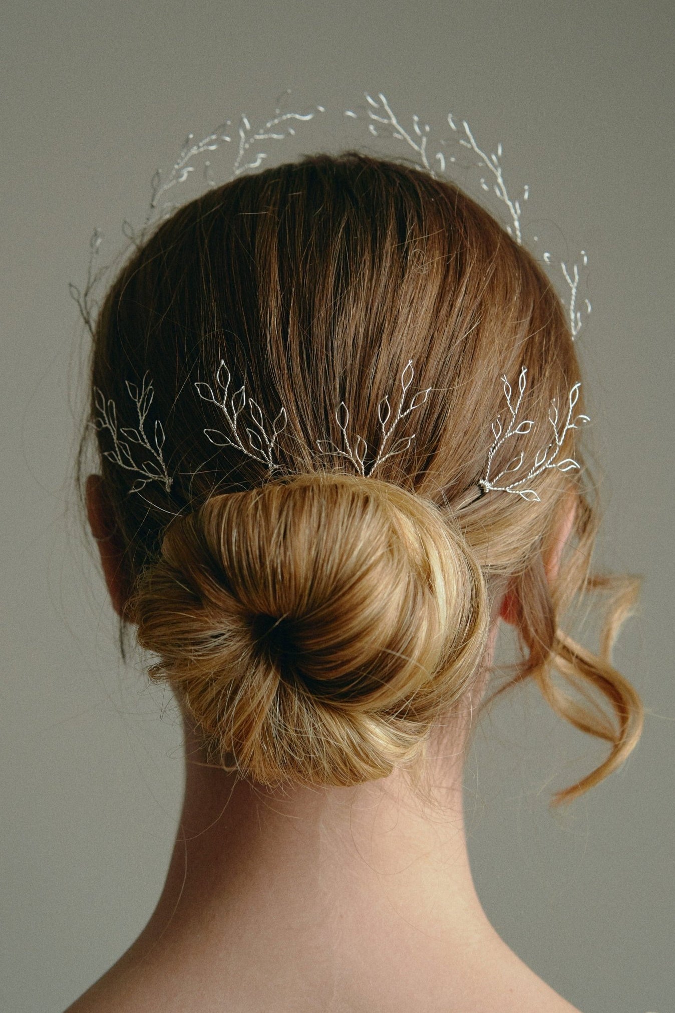 Leafy Wedding Hair Pins - Setof  Four Silver  Hairpins worn by model in the back of a low bun updo 