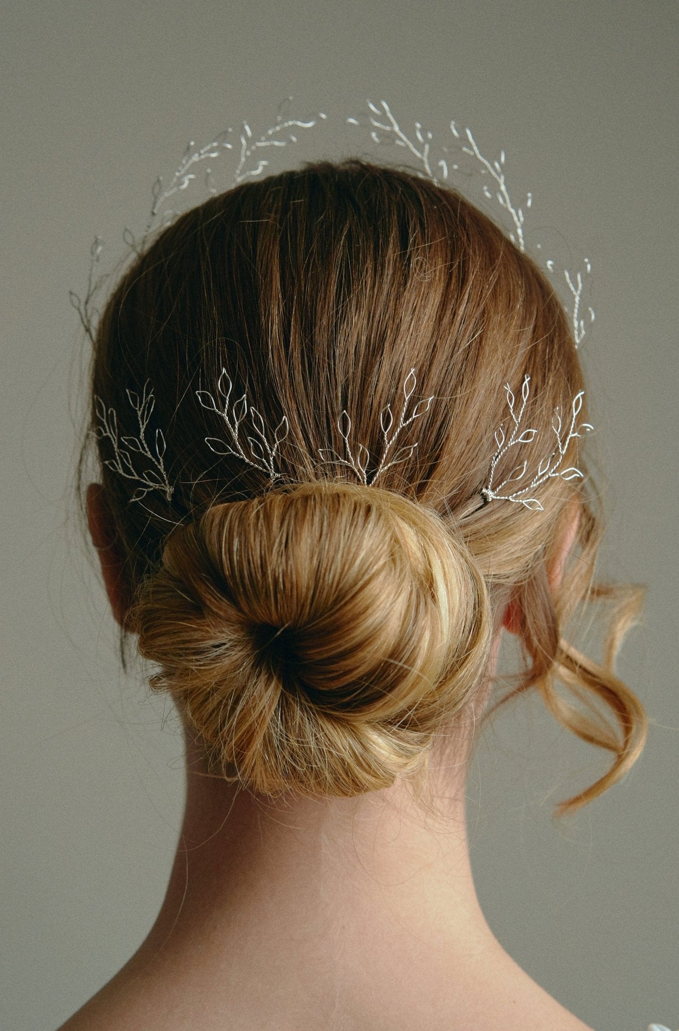 Leafy Wedding Hair Pins - Setof  Four Silver  Hairpins worn by model in the back of a low bun updo 