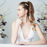 Silver Swarovski Crystal star and pearl cluster wedding hair comb worn with high pony tail