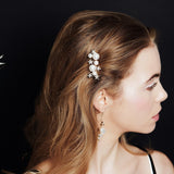 Gold Swarovski Crystal star and pearl cluster bridal hair comb worn to the side of the head