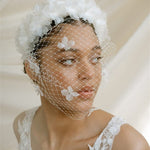 Betsy Ivory Birdcage Veil With 3D Silk Flowers worn with the Florence silk flower padded headband