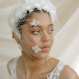 Betsy Ivory Birdcage Veil With 3D Silk Flowers worn with the Florence silk flower padded headband