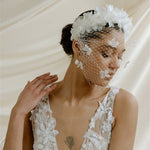 Betsy Ivory Birdcage Veil With 3D Silk Flowers worn with the Florence silk flower padded headband