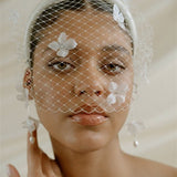 Betsy Ivory Birdcage Veil With 3D Silk Flowers worn with the Esther padded headband