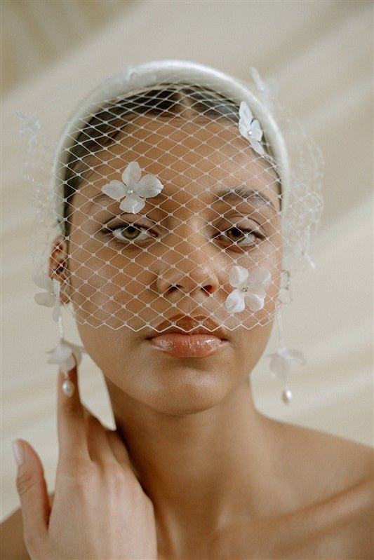 Betsy Ivory Birdcage Veil With 3D Silk Flowers worn with the Esther padded headband