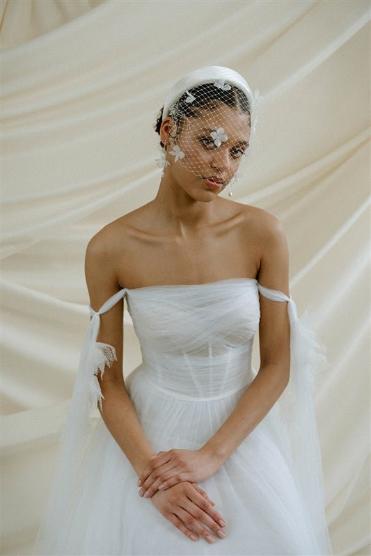 Betsy Ivory Birdcage Veil With 3D Silk Flowers worn with the Esther silk flower padded headband
