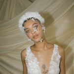 Betsy Ivory Birdcage Veil With 3D Silk Flowers worn with the Florence silk flower padded headband