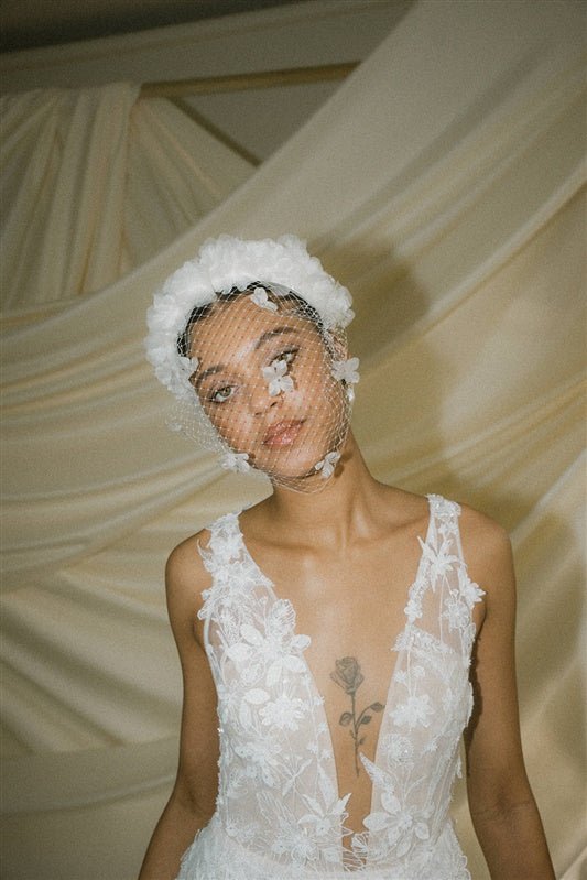 Betsy Ivory Birdcage Veil With 3D Silk Flowers worn with the Florence silk flower padded headband