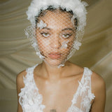 Betsy Ivory Birdcage Veil With 3D Silk Flowers worn with the Florence silk flower padded headband