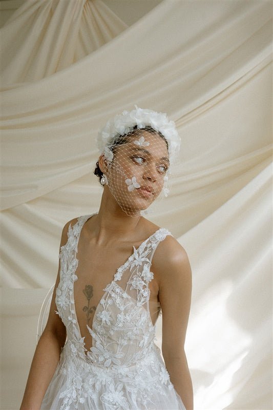 Betsy Ivory Birdcage Veil With 3D Silk Flowers worn with the Florence silk flower padded headband