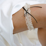 the Bonnie garter with its exquisite ivory tulle gathered fabric finished with a simple slim black or ivory satin bow