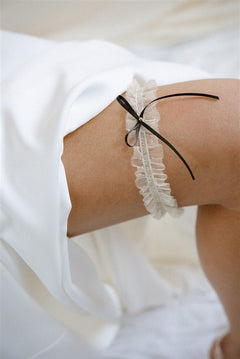 the Bonnie garter with its exquisite ivory tulle gathered fabric finished with a simple slim black or ivory satin bow