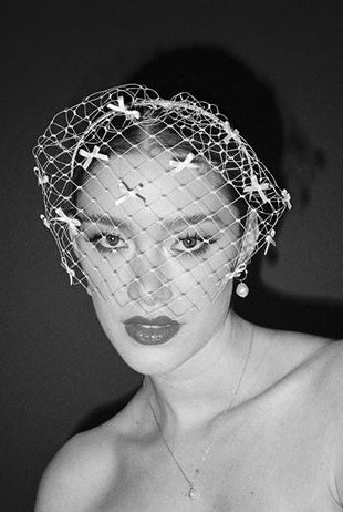 bride wears a bow birdcage veil on a slim headband - black and white film image