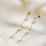 round sustainable pearl drop earrings with gold chain