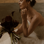 Bride wearing a lace edged tulle short micro veil in Juliet cap veil position, teamed with Dorothy long drop pearl earrings.
