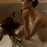 Bride wearing a lace edged tulle short micro veil in Juliet cap veil position, teamed with Dorothy long drop pearl earrings.