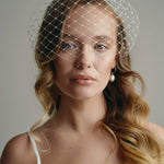 Slim ivory satin headband with attached Merry Widow veil