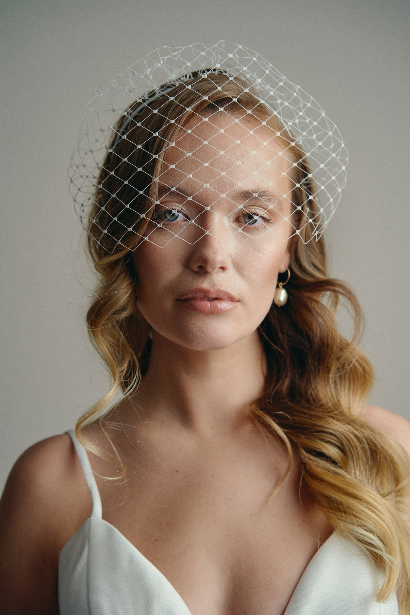 Slim ivory satin headband with attached Merry Widow veil