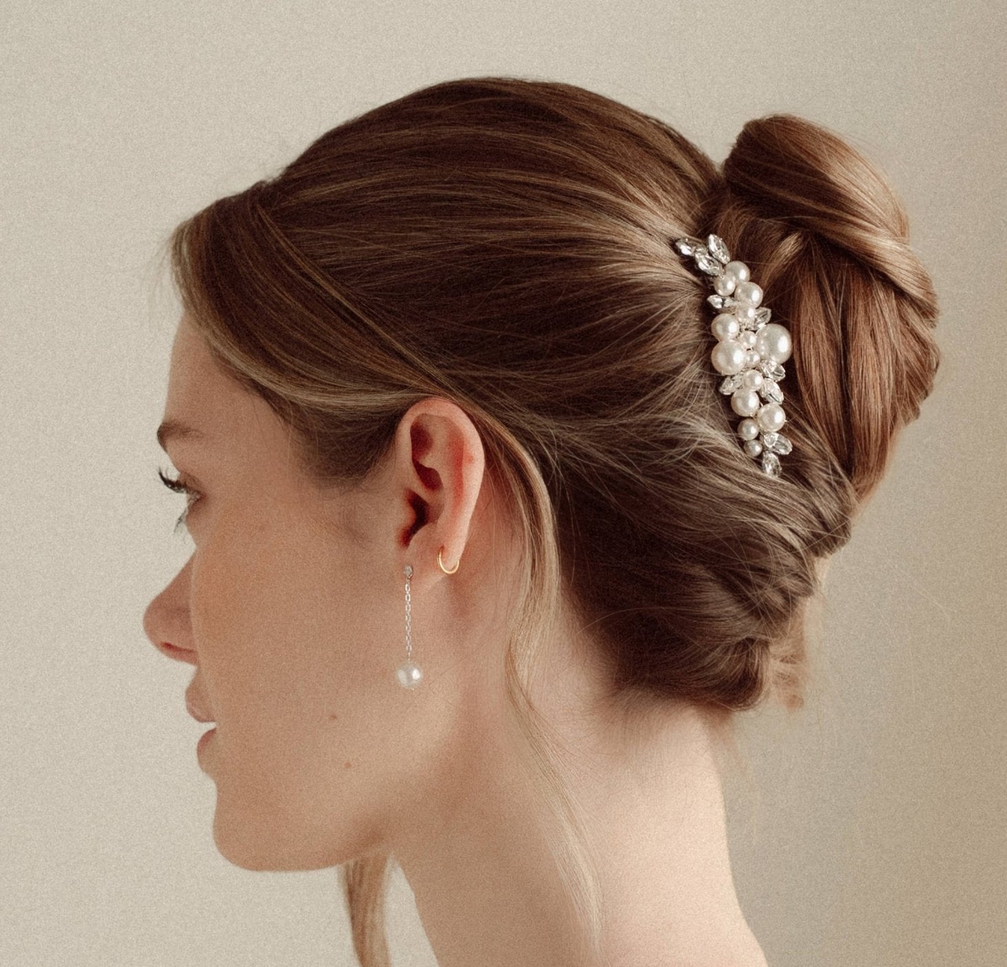 Silver crystal and pearl dainty drop earrings worn with a crystal and pearl cluster hair comb