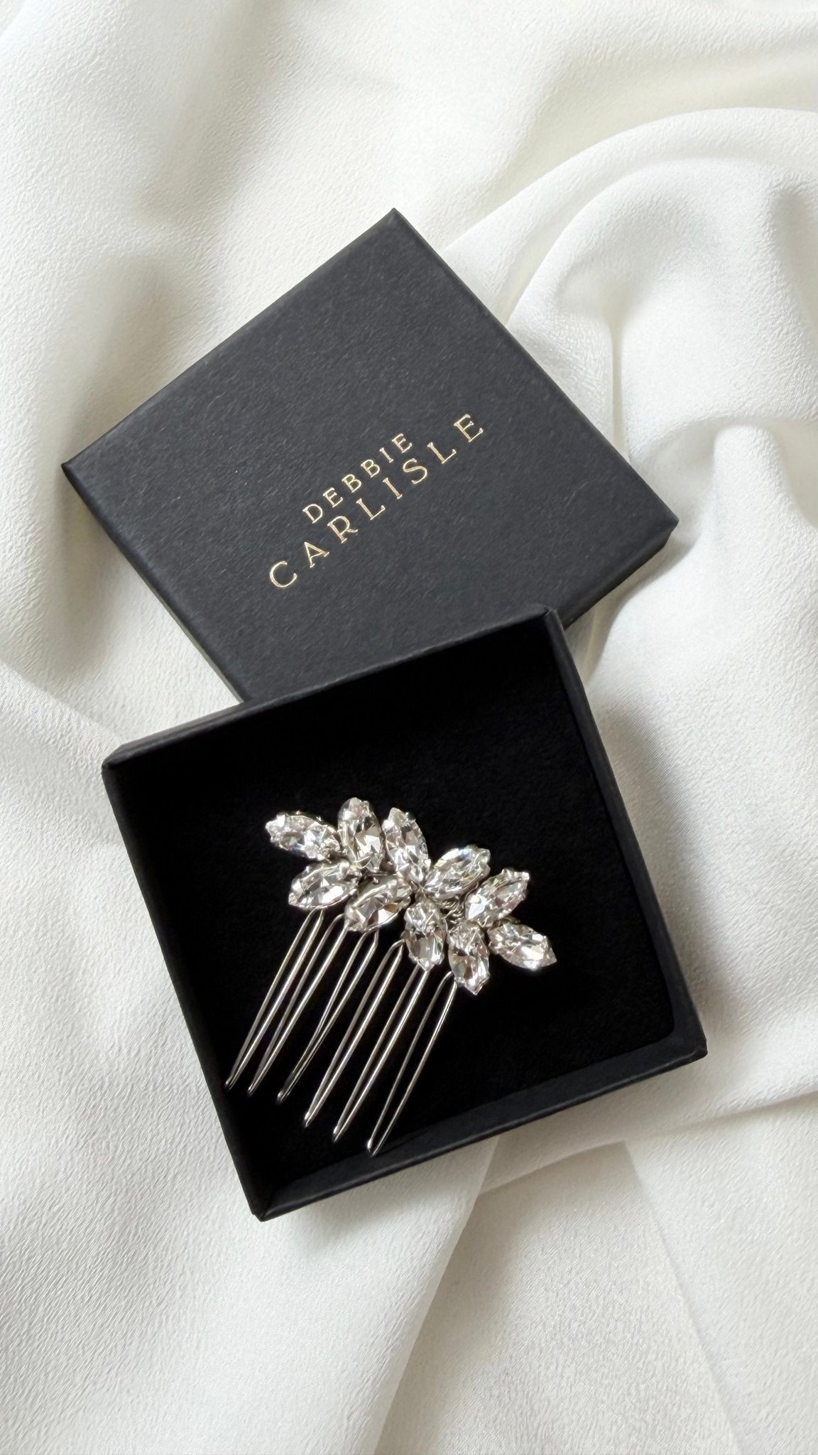 small crystal bridal hair comb in black display box with Debbie Carlisle logo in gold