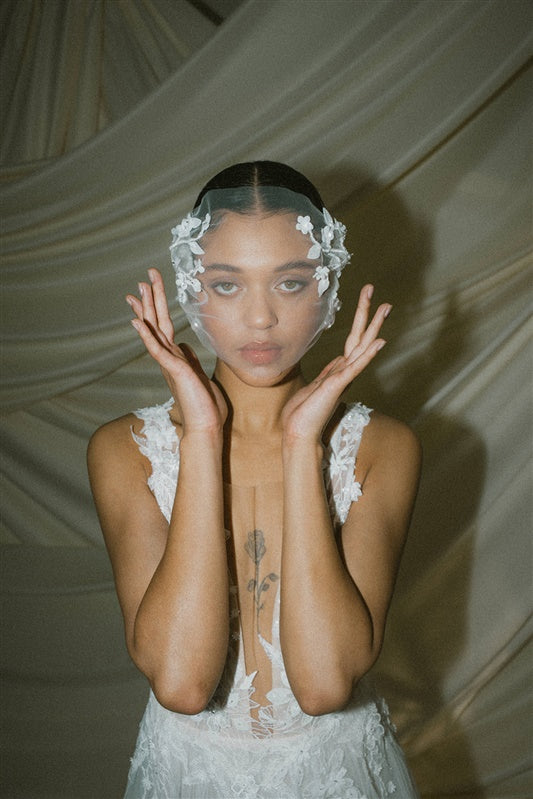 bride wears a floral tulle mask micro veil