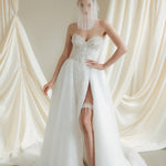 Bride wears a sheer tulle drop micro veil with pearl and crystal embellishments 