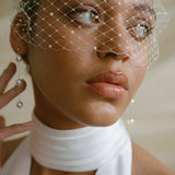 Keisha pearl birdcage veil worn with Dora pearl drop earrings