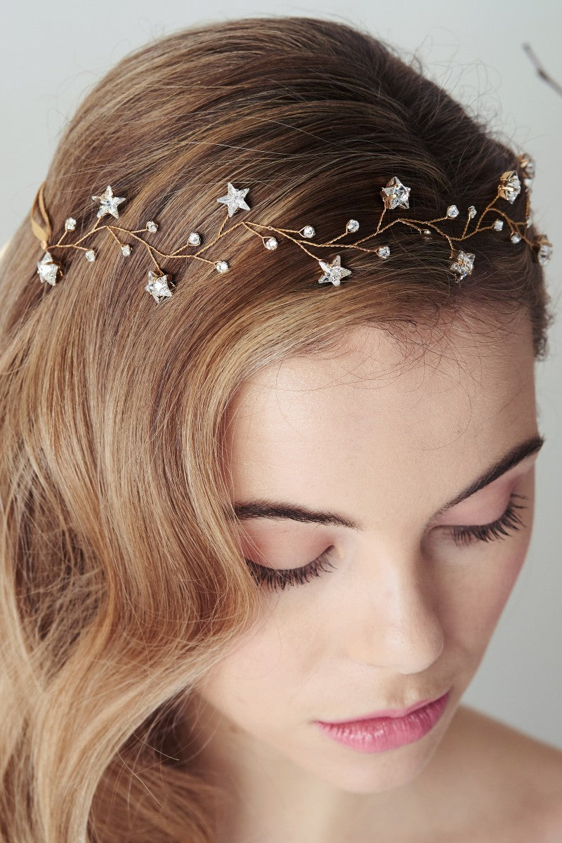 Model wears crystal star encrusted bridal hair accessory 
