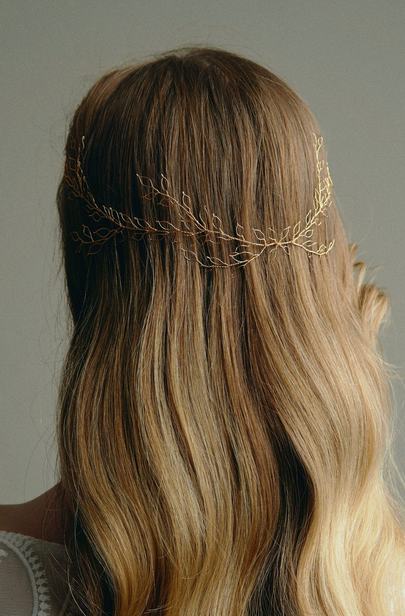 Bridal Hair Vine - model wears long leafy gold bridal hair vine